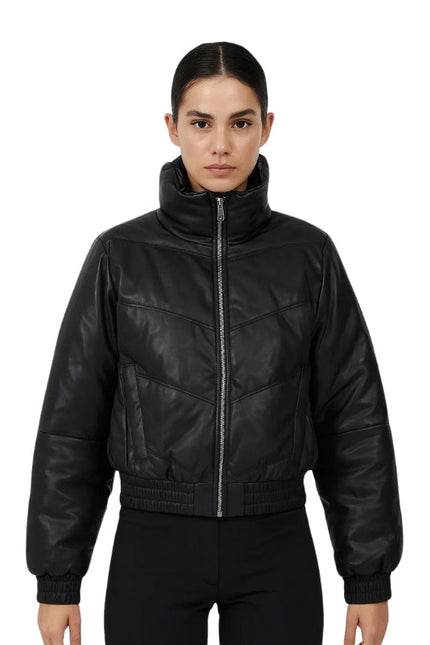 Person wearing a black leather bomber jacket on a white background