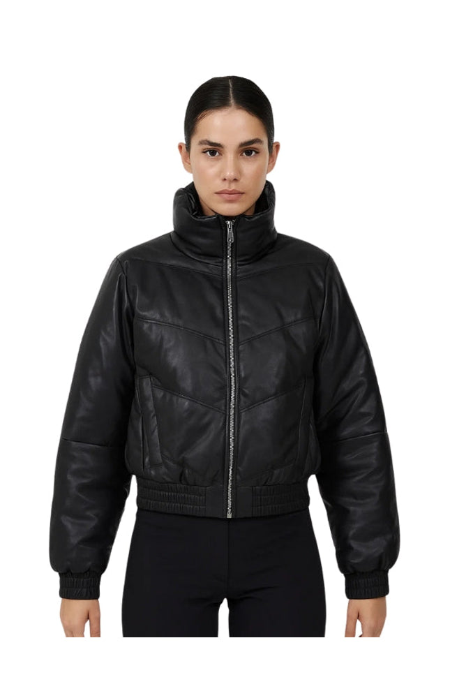 Person wearing a black leather bomber jacket on a white background