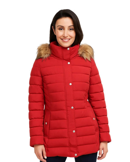 Woman wearing a red puffer jacket with fur trim on a white background