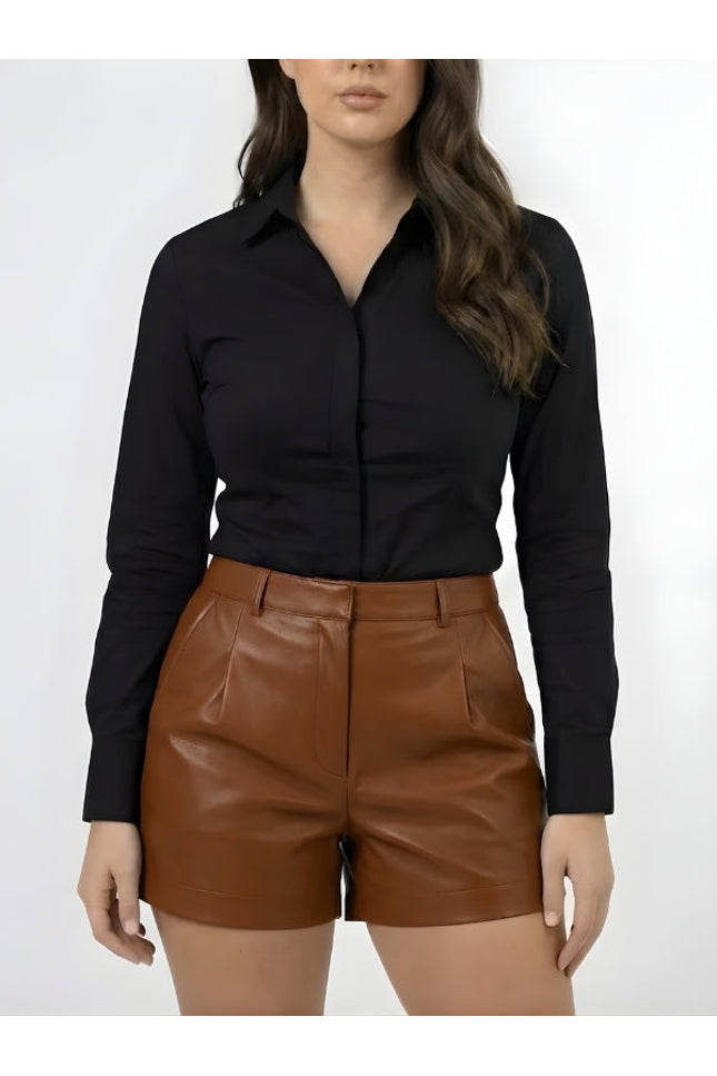 Person wearing a black shirt and brown leather shorts on a white background