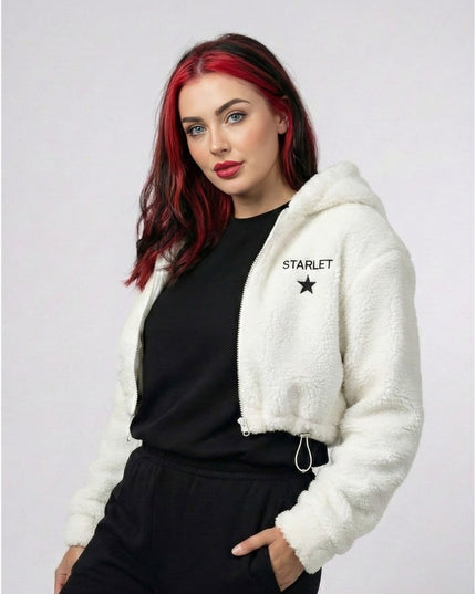 Woman wearing a white hoodie with 'STARLET' branding on a plain background