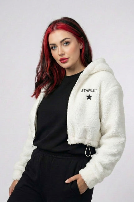 Woman wearing a white hoodie with 'STARLET' branding on a plain background