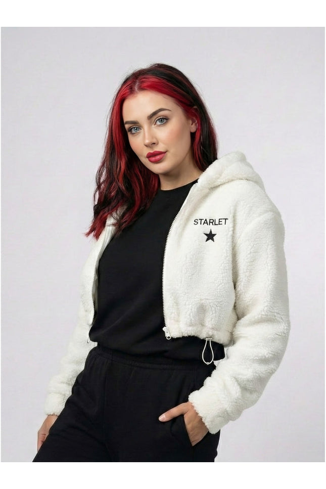 Woman wearing a white hoodie with 'STARLET' branding on a plain background