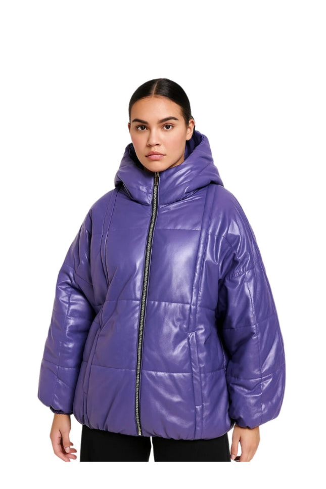 Woman wearing a purple puffer jacket on a white background