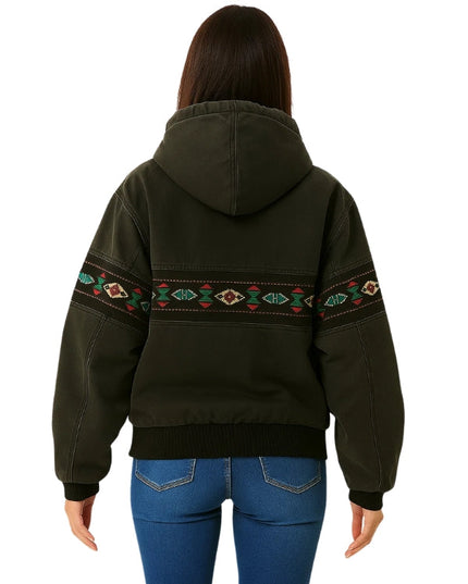 Person wearing a dark green hoodie with tribal patterns on the back, standing against a white background.