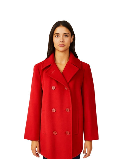 Woman wearing a red coat on a white background