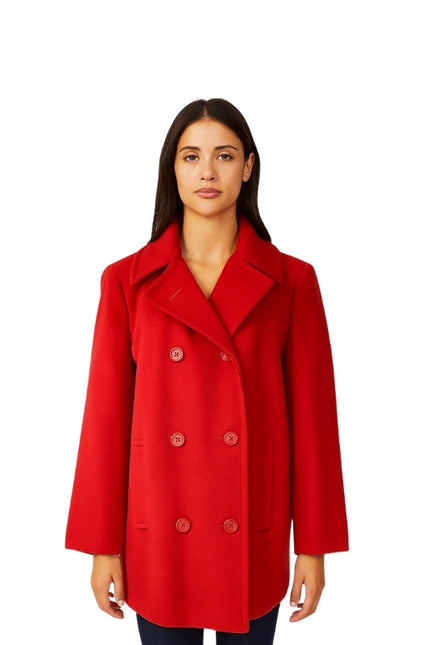 Woman wearing a red coat on a white background