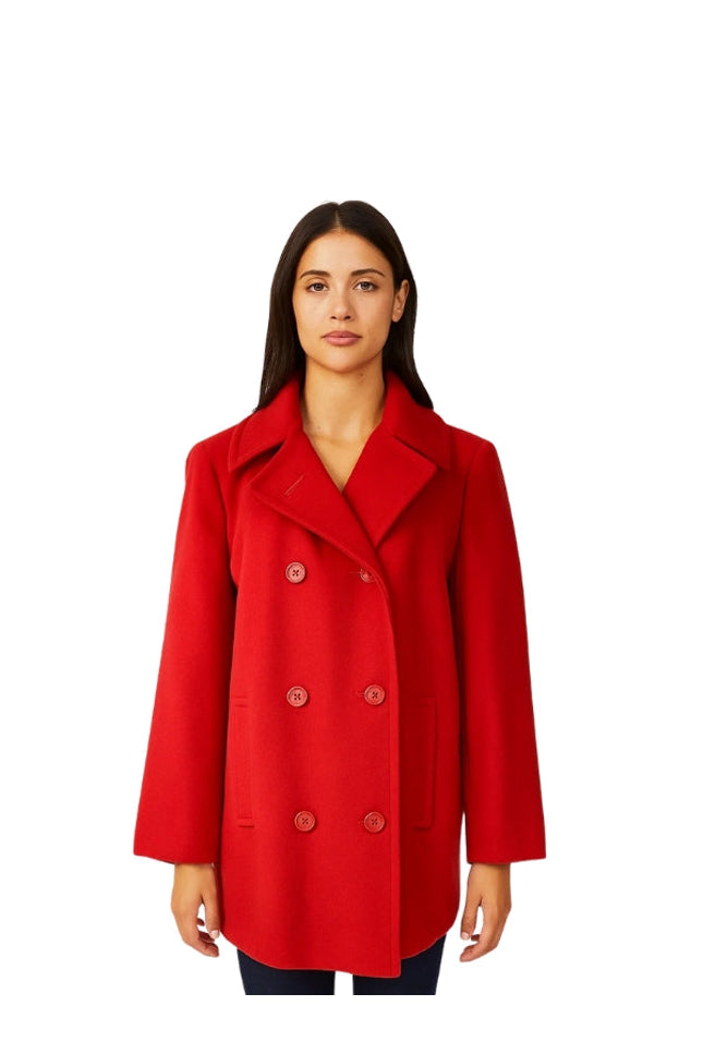 Woman wearing a red coat on a white background