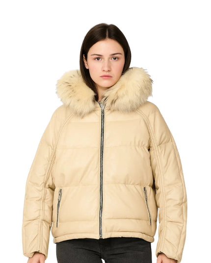 Woman wearing a beige puffer jacket with fur hood on a white background