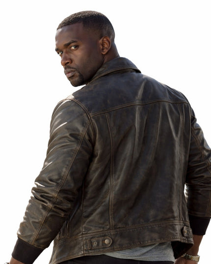 Man wearing a dark leather jacket on a white background
