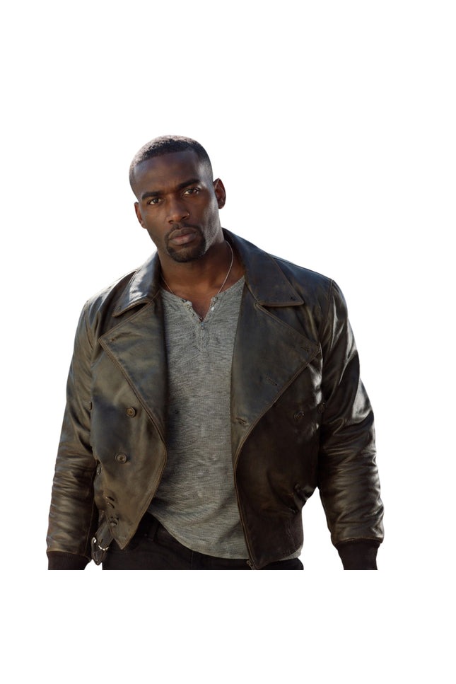 Man wearing a brown leather jacket over a gray shirt on a white background