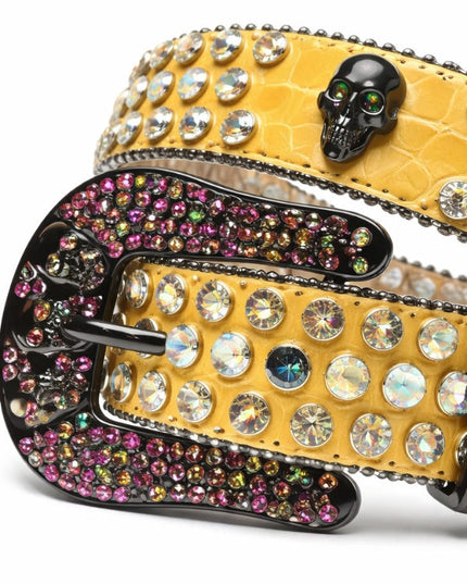 Yellow belt with rhinestone embellishments and a skull buckle on a white background