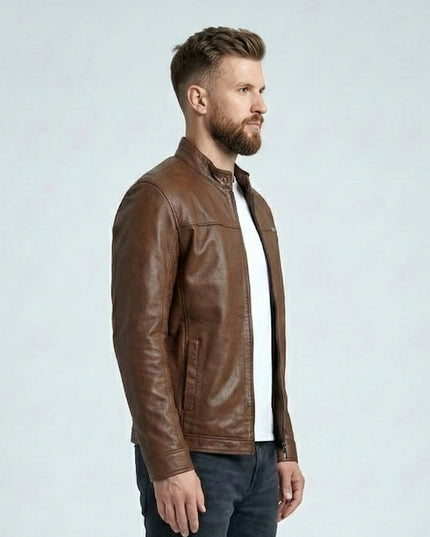 Man wearing a brown leather jacket on a light gray background
