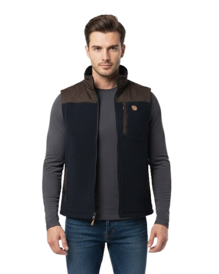 Man wearing a black and brown jacket on a white background