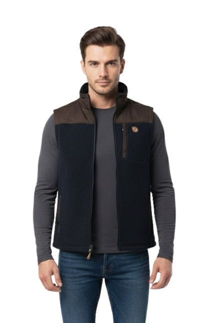 Man wearing a black and brown jacket on a white background