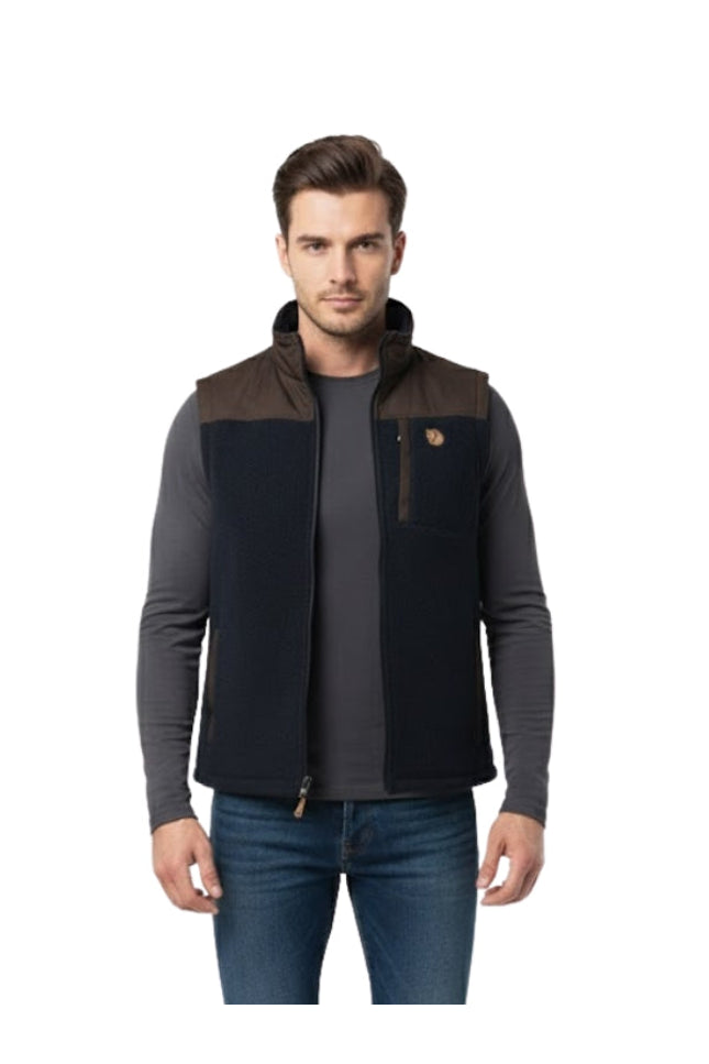 Man wearing a black and brown jacket on a white background