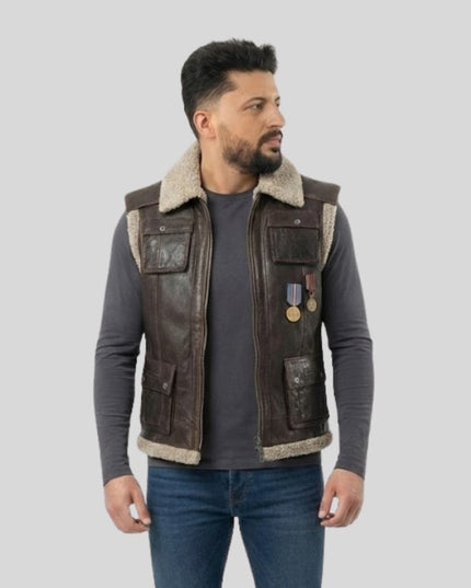 Man wearing a brown leather vest with fur lining on a gray background