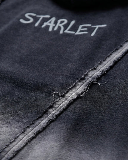 Black fabric with 'STARLET' embroidered on it