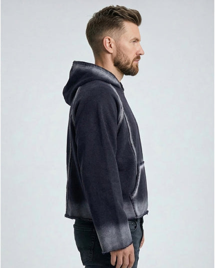 Man wearing a gray hoodie with gradient design on a white background
